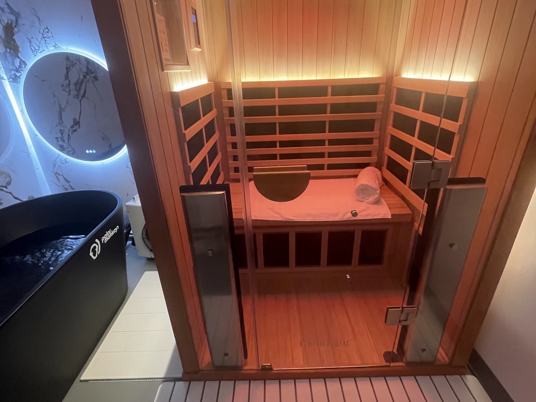 Cold plunge tub and infrared sauna cabin together in one private Sauna House suite